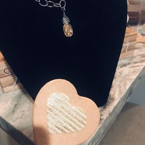 Swarovski bracelet with pineapple charm.